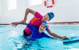 boy taking swim lessons at indoor pool-a1 scuba