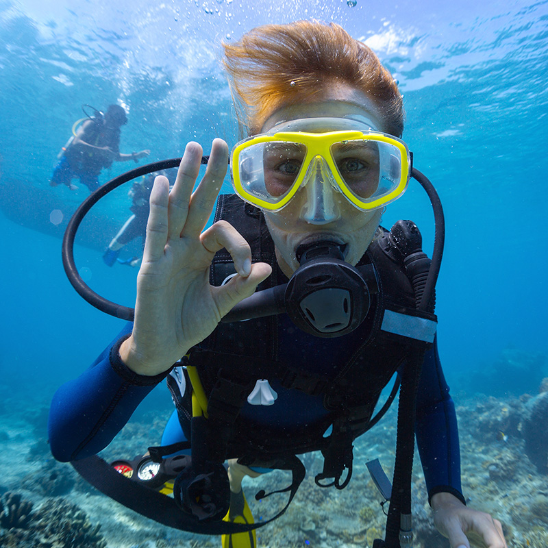 Scuba Diver giving the OK sign underwater